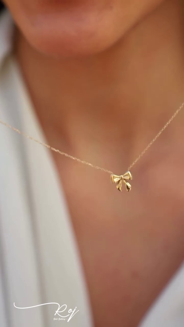 Delicate Bow Necklace: A Touch of Whimsy in Gold